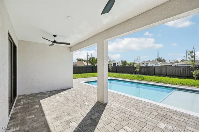 an aerial view of a house with a big yard