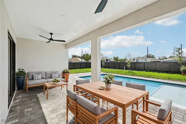a view of an outdoor space with furniture and yard