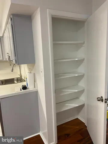 a view of storage and utility room with washer and dryer
