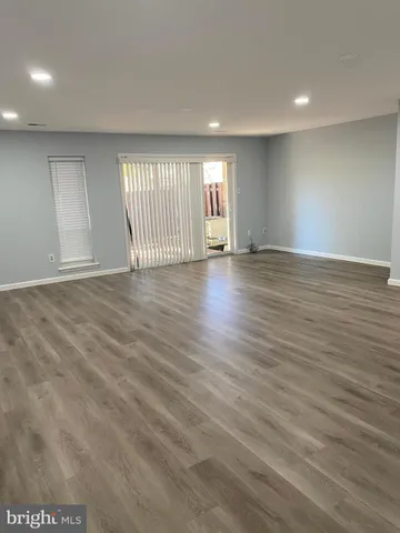 a swimming pool with trees in the background