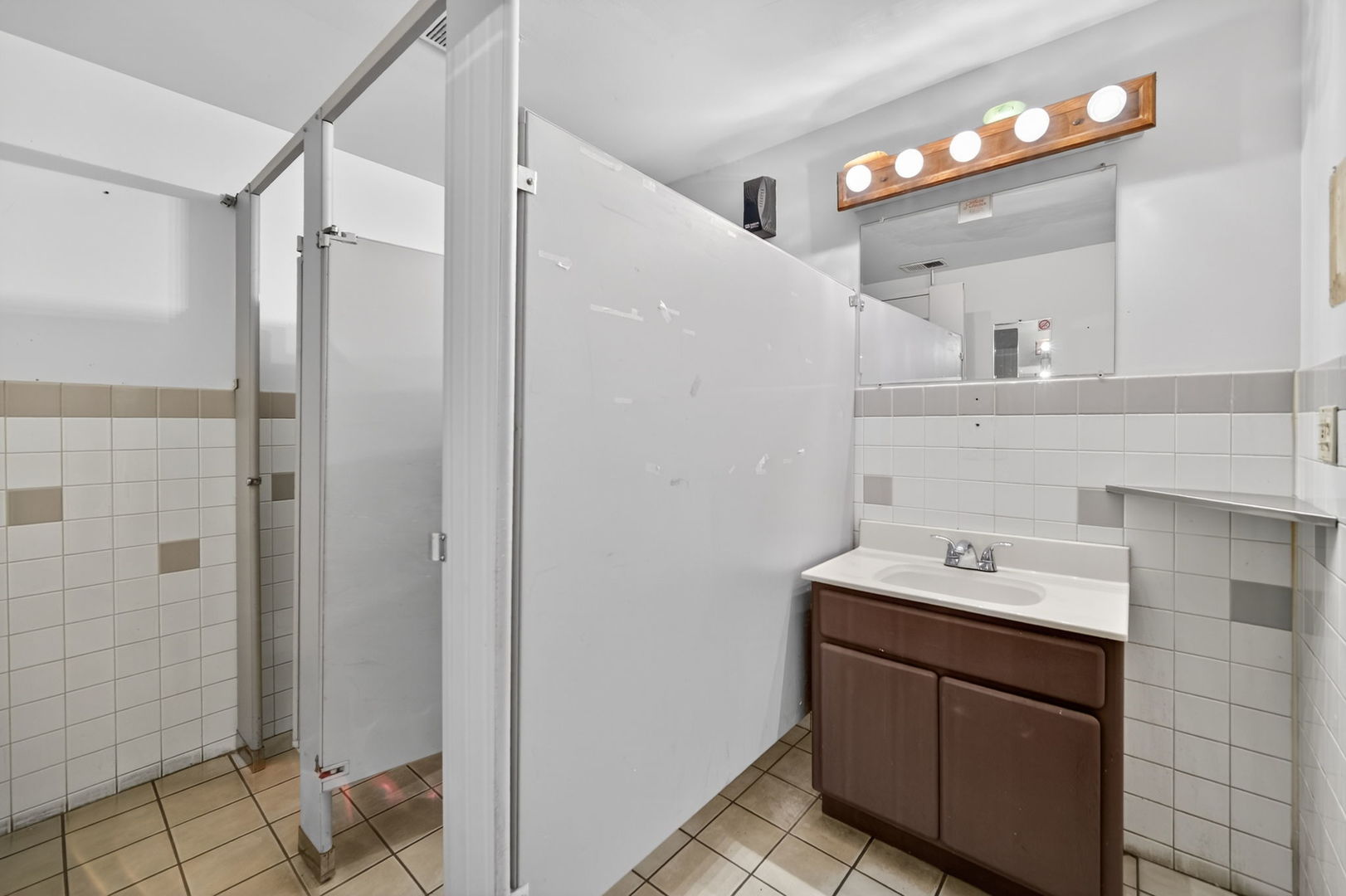 4369 North Elston Avenue Chicago, IL 60641 - Photo 18 of 43 a bathroom with a sink and a mirror