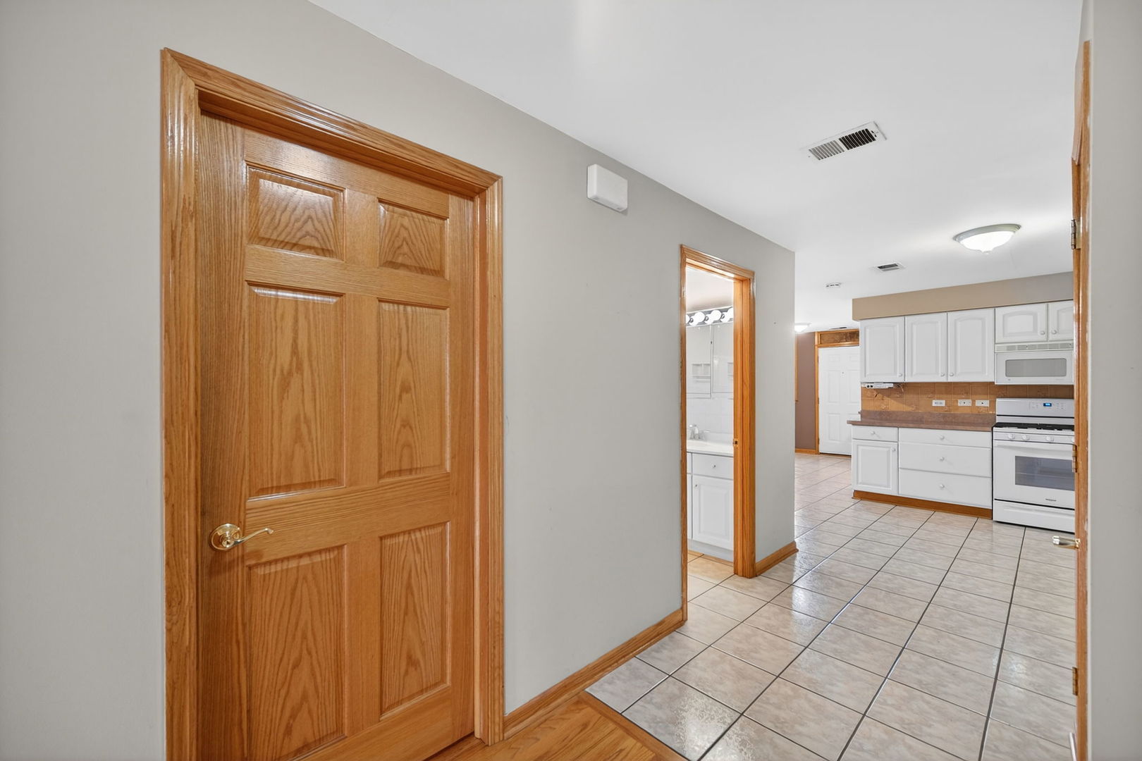 4369 North Elston Avenue Chicago, IL 60641 - Photo 23 of 43 a view of a kitchen with a refrigerator and a stove top oven