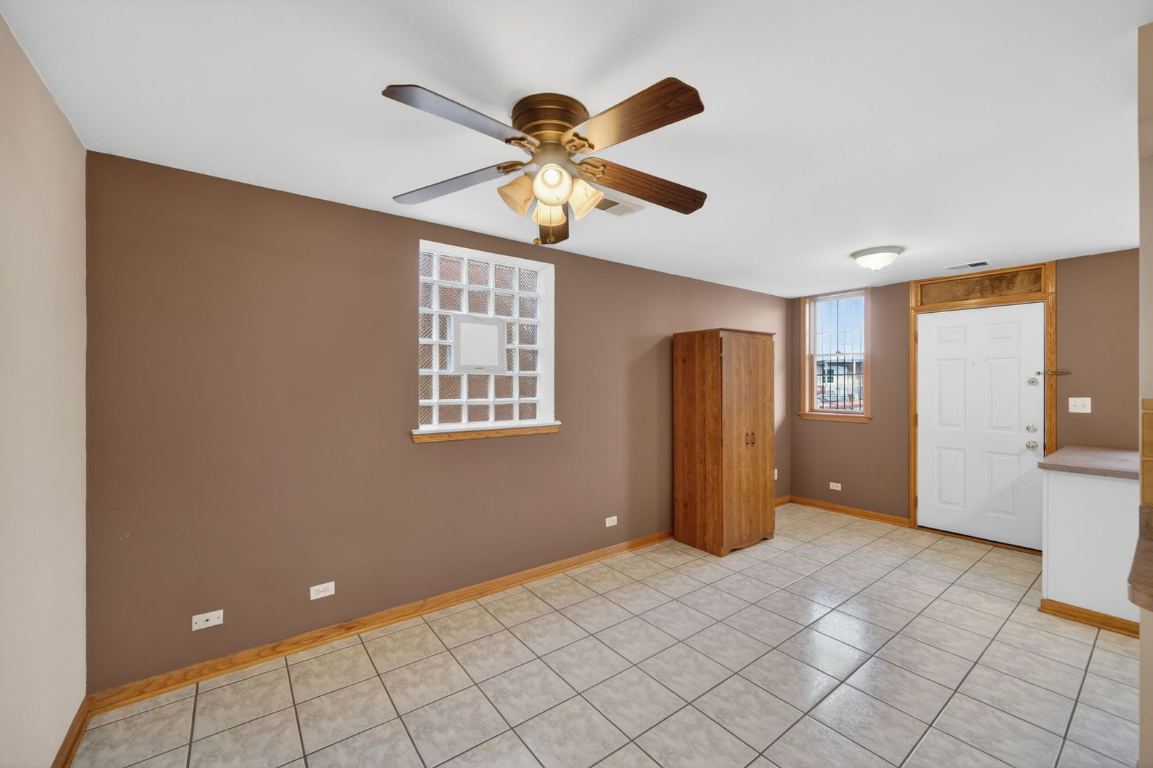 4369 North Elston Avenue Chicago, IL 60641 - Photo 28 of 43 a view of an empty room with window and chandelier fan