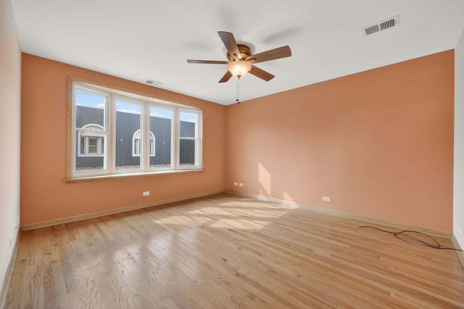 4369 North Elston Avenue Chicago, IL 60641 - Photo 34 of 43 a view of empty room with wooden floor and fan