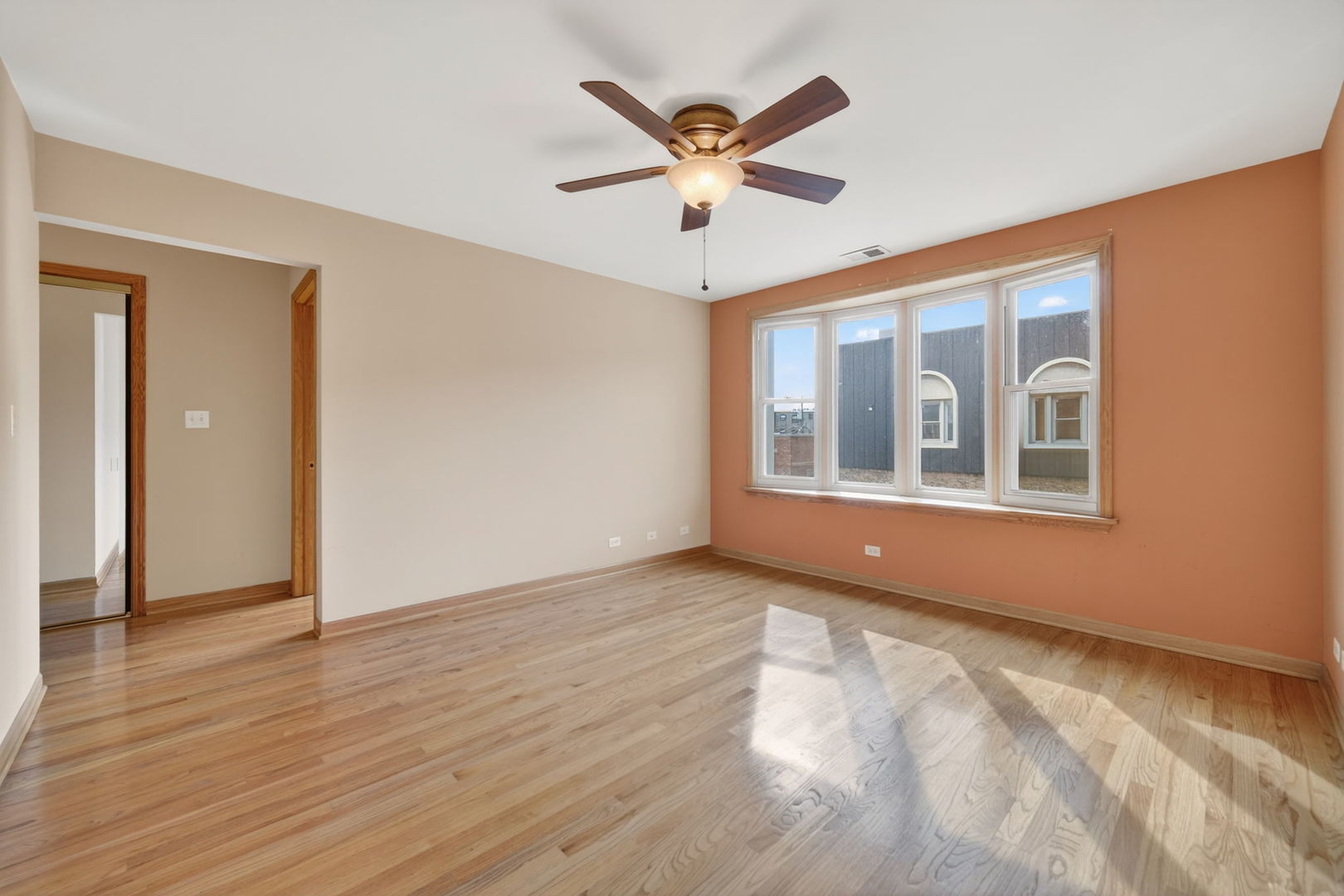 4369 North Elston Avenue Chicago, IL 60641 - Photo 35 of 43 a view of an empty room with window and wooden floor