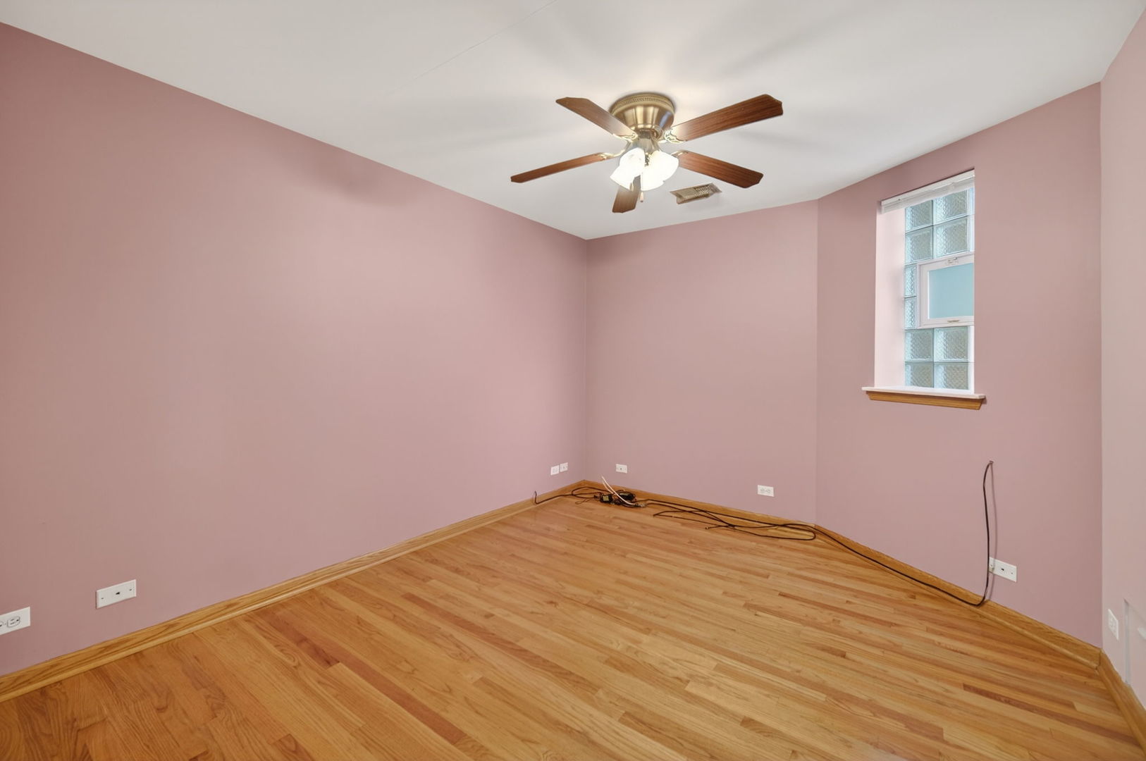 4369 North Elston Avenue Chicago, IL 60641 - Photo 38 of 43 a view of an empty room with chandelier fan and a window