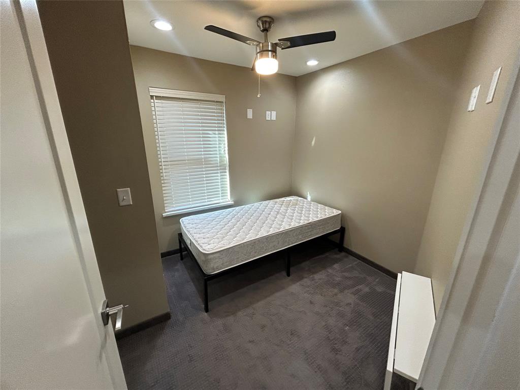 301 East Brockett Street Sherman, TX 75090 - Photo 11 of 14 a bedroom with a bed and a window