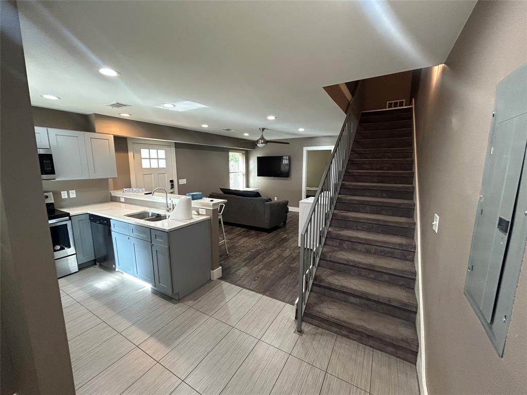 301 East Brockett Street Sherman, TX 75090 - Photo 3 of 14 a kitchen with a sink and cabinets