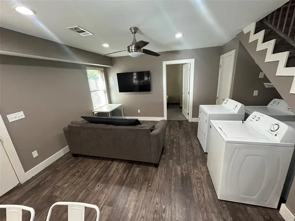 a living room with a couch and a flat screen tv