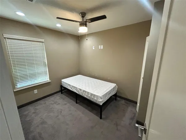 a room with a bed and a window