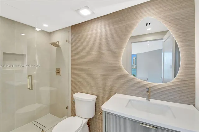 a bathroom with a sink a mirror and a light fixture