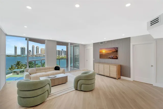 a kitchen with stainless steel appliances a stove a sink and a refrigerator