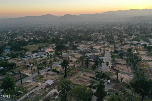 a view of a town with mountains in the background