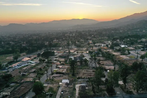 an aerial view of residential house and green space