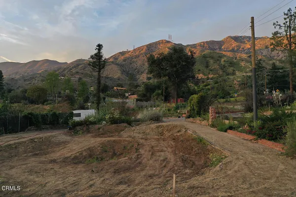 a view of a town with mountains in the background