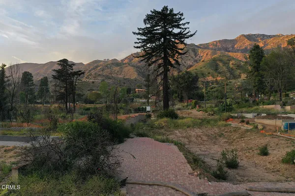 a view of a house with a mountain yard and mountain view