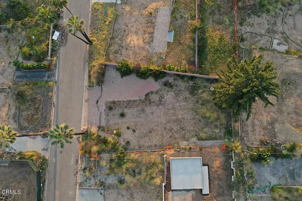 an aerial view of a house with a yard and a yard