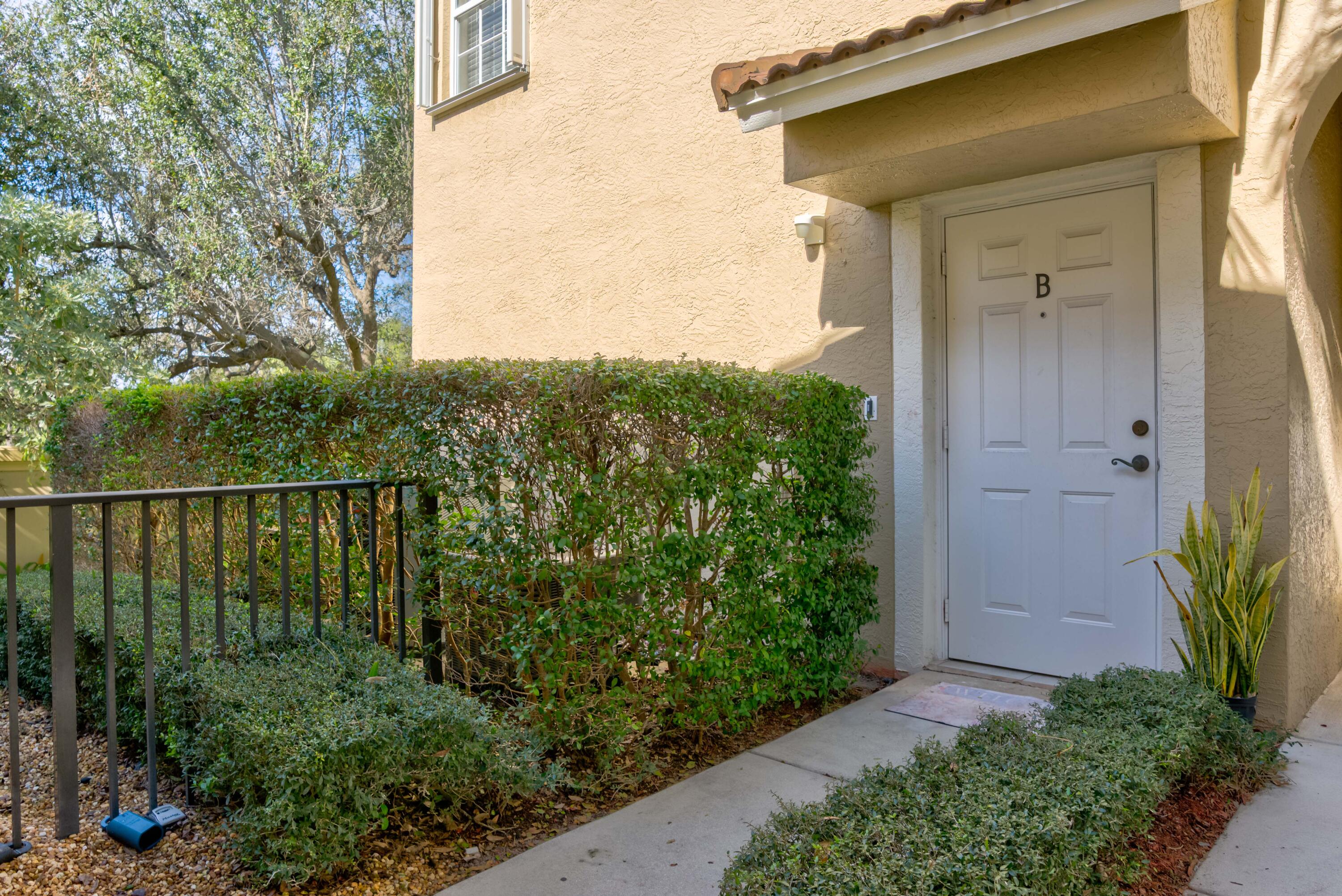 115 Lighthouse Circle, Unit B Tequesta, FL 33469 - Photo 11 of 42 a balcony with next to a yard