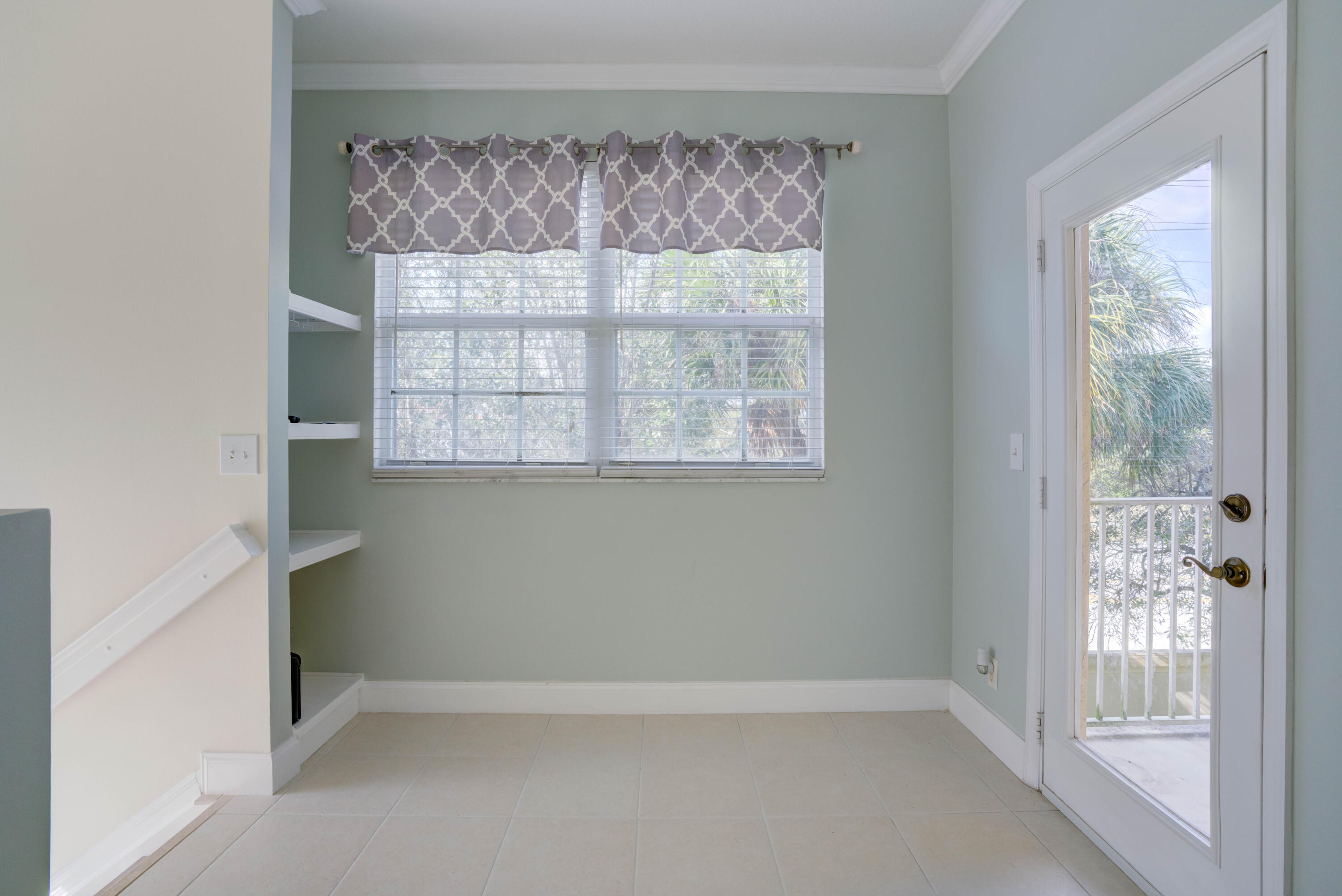 115 Lighthouse Circle, Unit B Tequesta, FL 33469 - Photo 15 of 42 a view of an empty room with a window