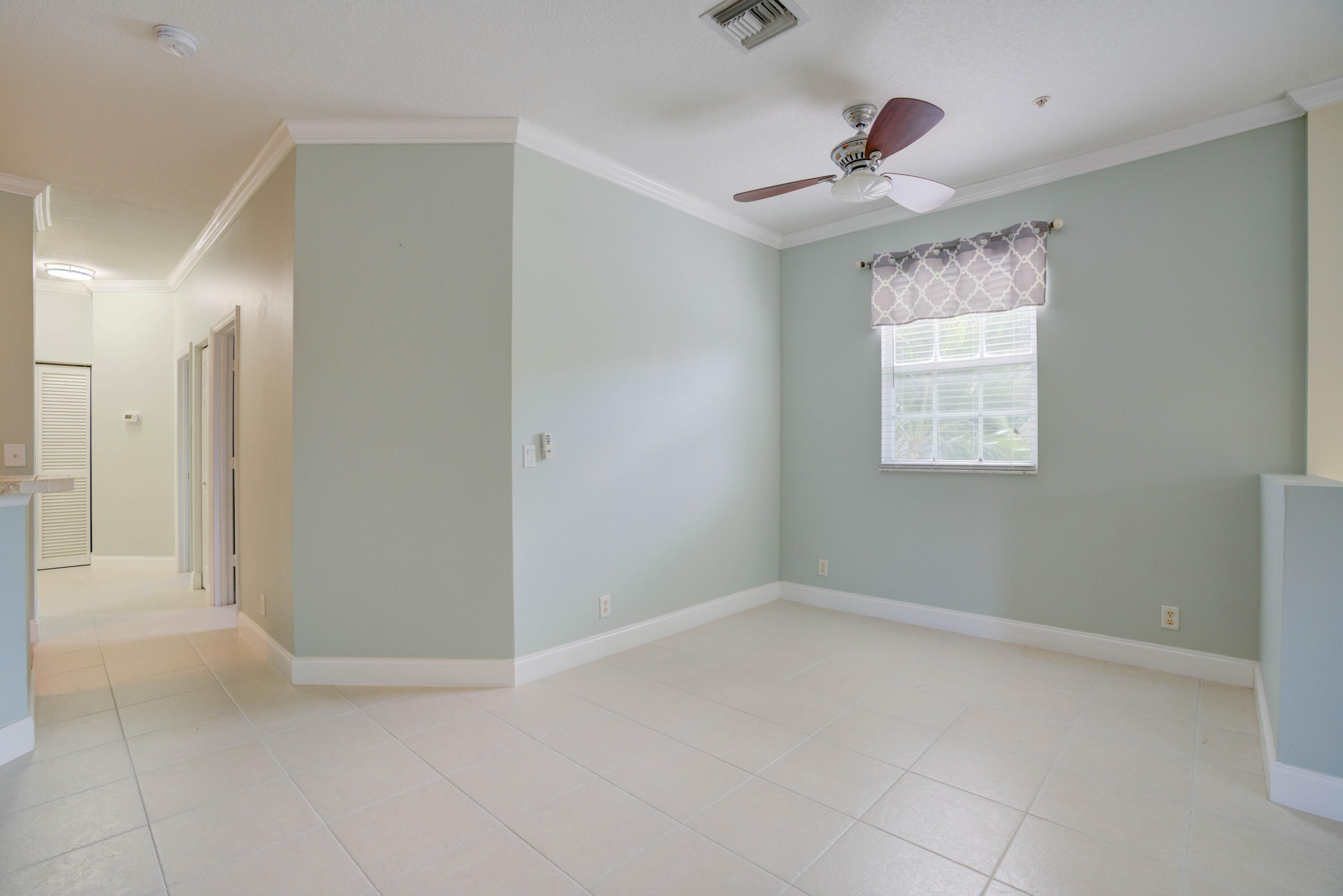115 Lighthouse Circle, Unit B Tequesta, FL 33469 - Photo 22 of 42 a view of an empty room with a window