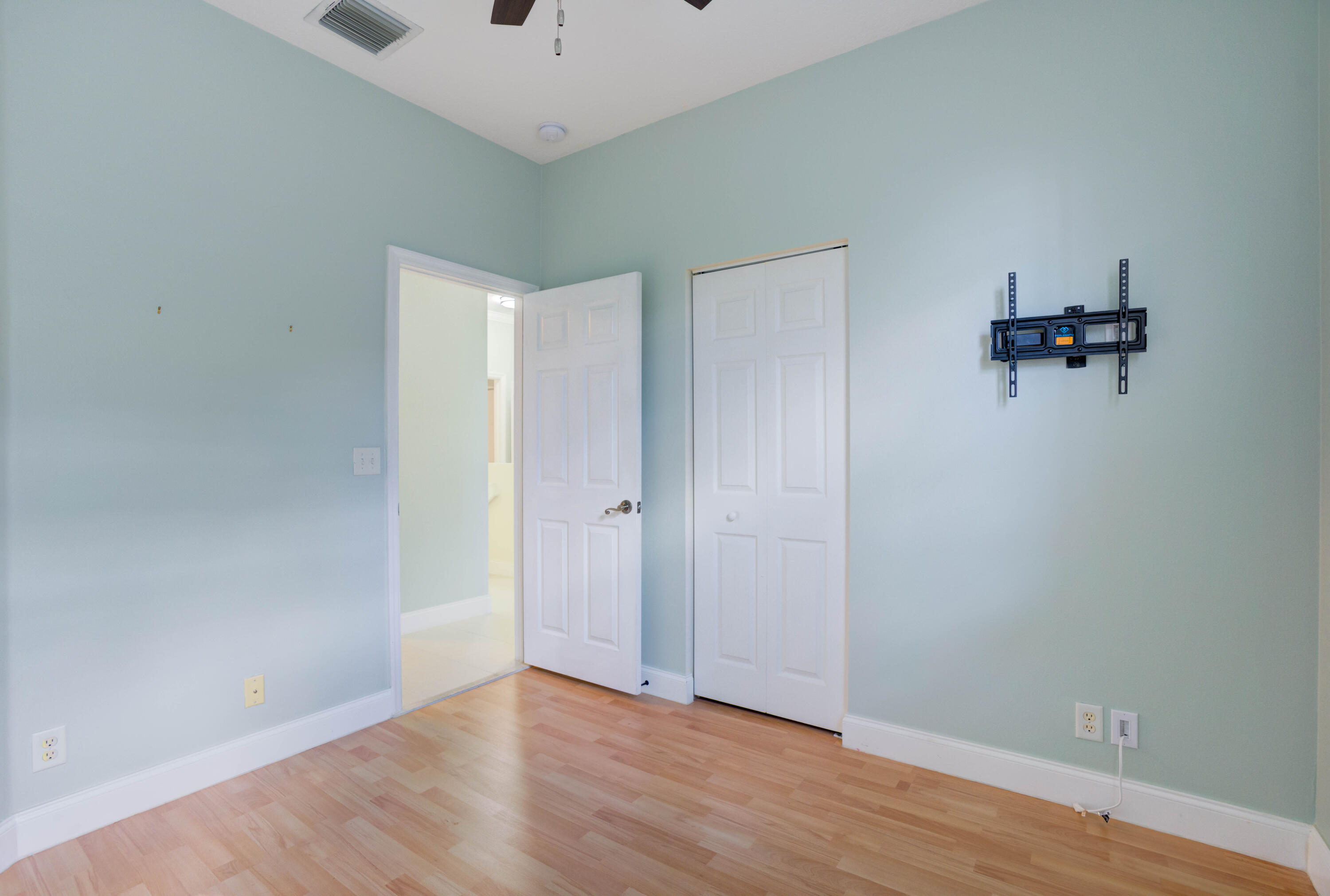 115 Lighthouse Circle, Unit B Tequesta, FL 33469 - Photo 27 of 42 wooden floor in an empty room