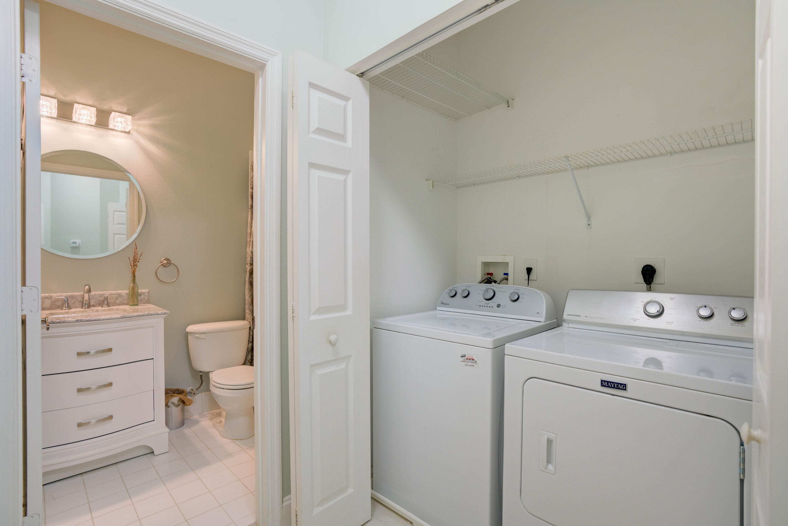 115 Lighthouse Circle, Unit B Tequesta, FL 33469 - Photo 33 of 42 a view of bathroom with a washer and dryer