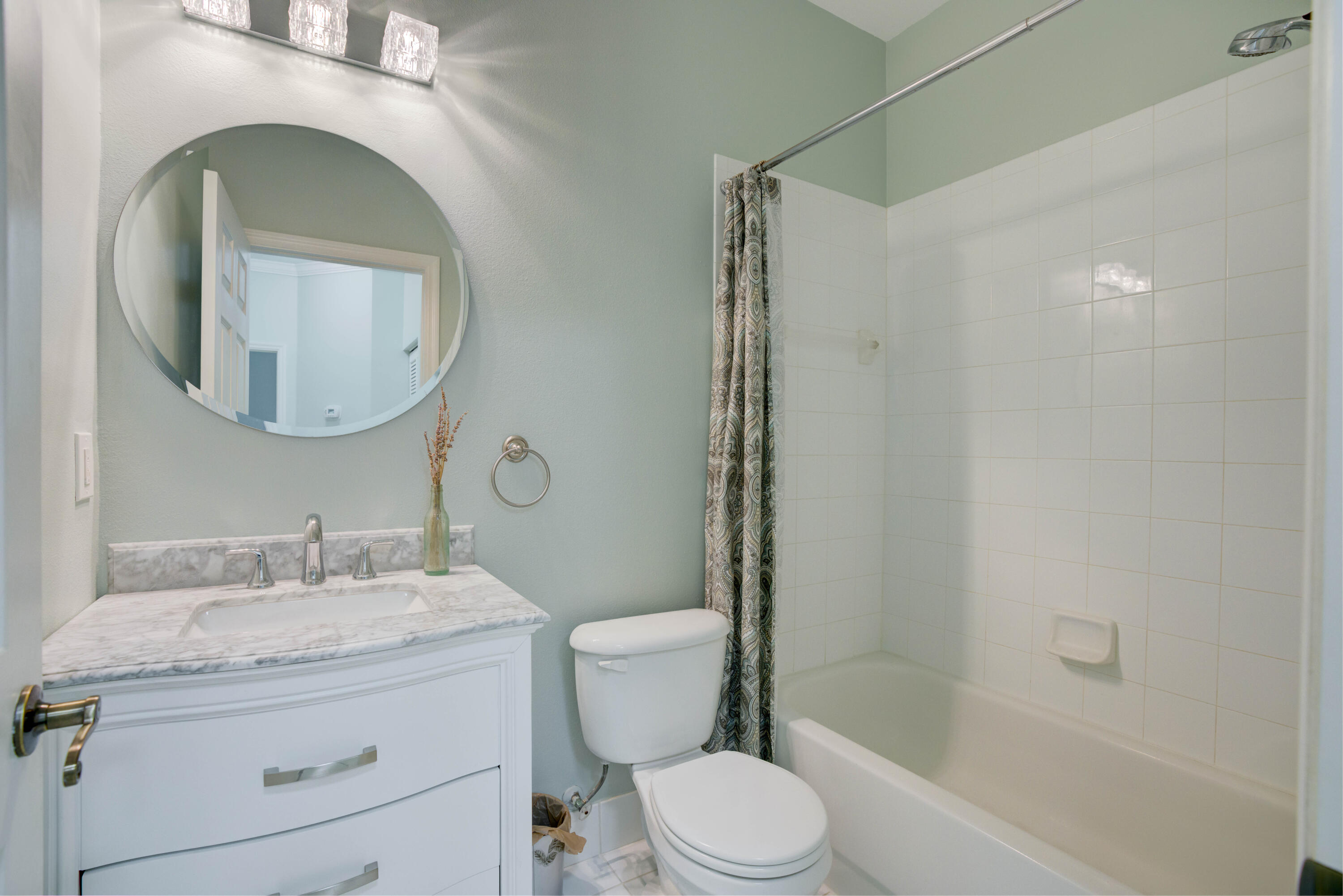 115 Lighthouse Circle, Unit B Tequesta, FL 33469 - Photo 35 of 42 a bathroom with a granite countertop sink toilet and shower