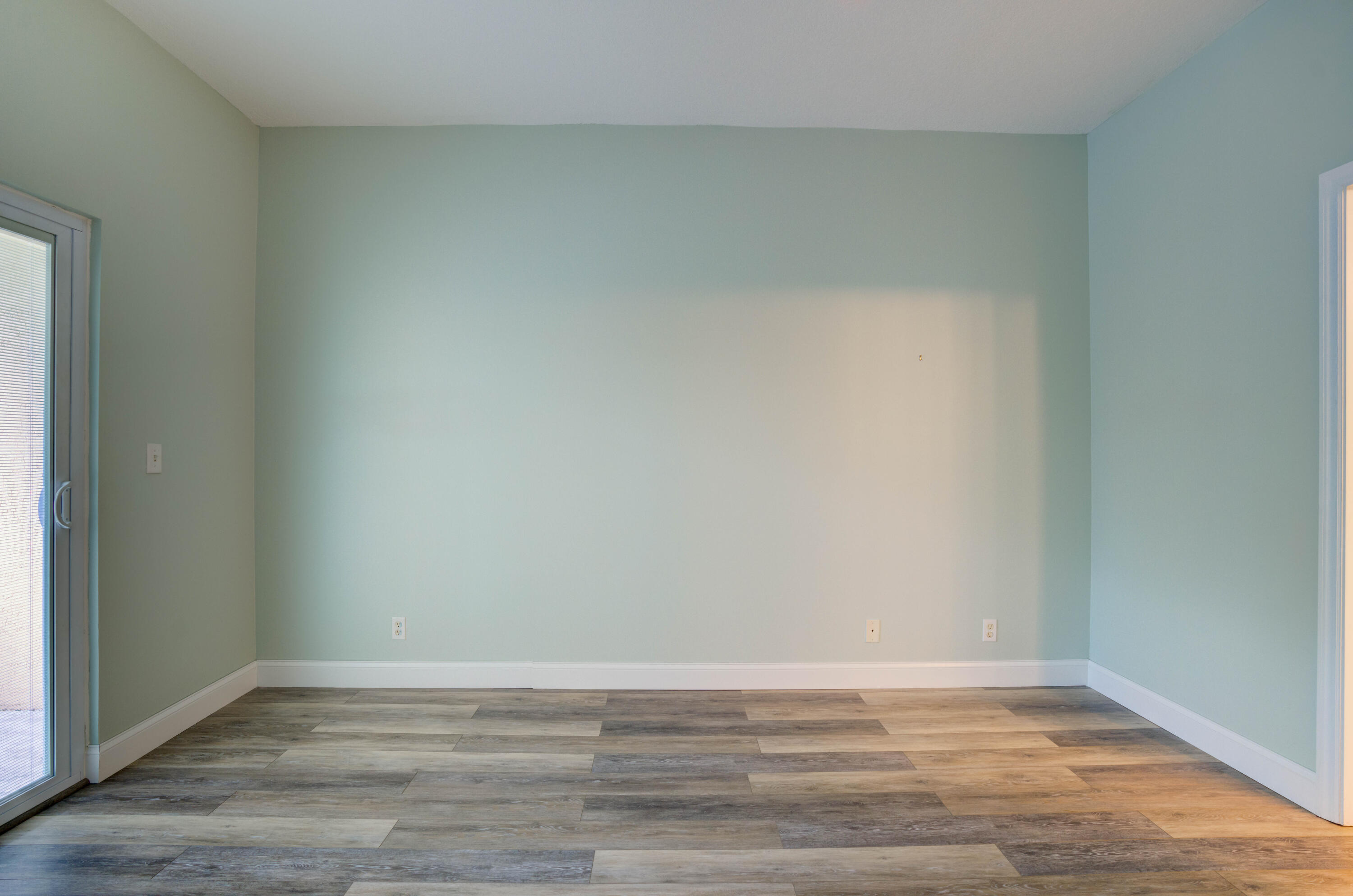 115 Lighthouse Circle, Unit B Tequesta, FL 33469 - Photo 37 of 42 a view of an empty room and wooden floor