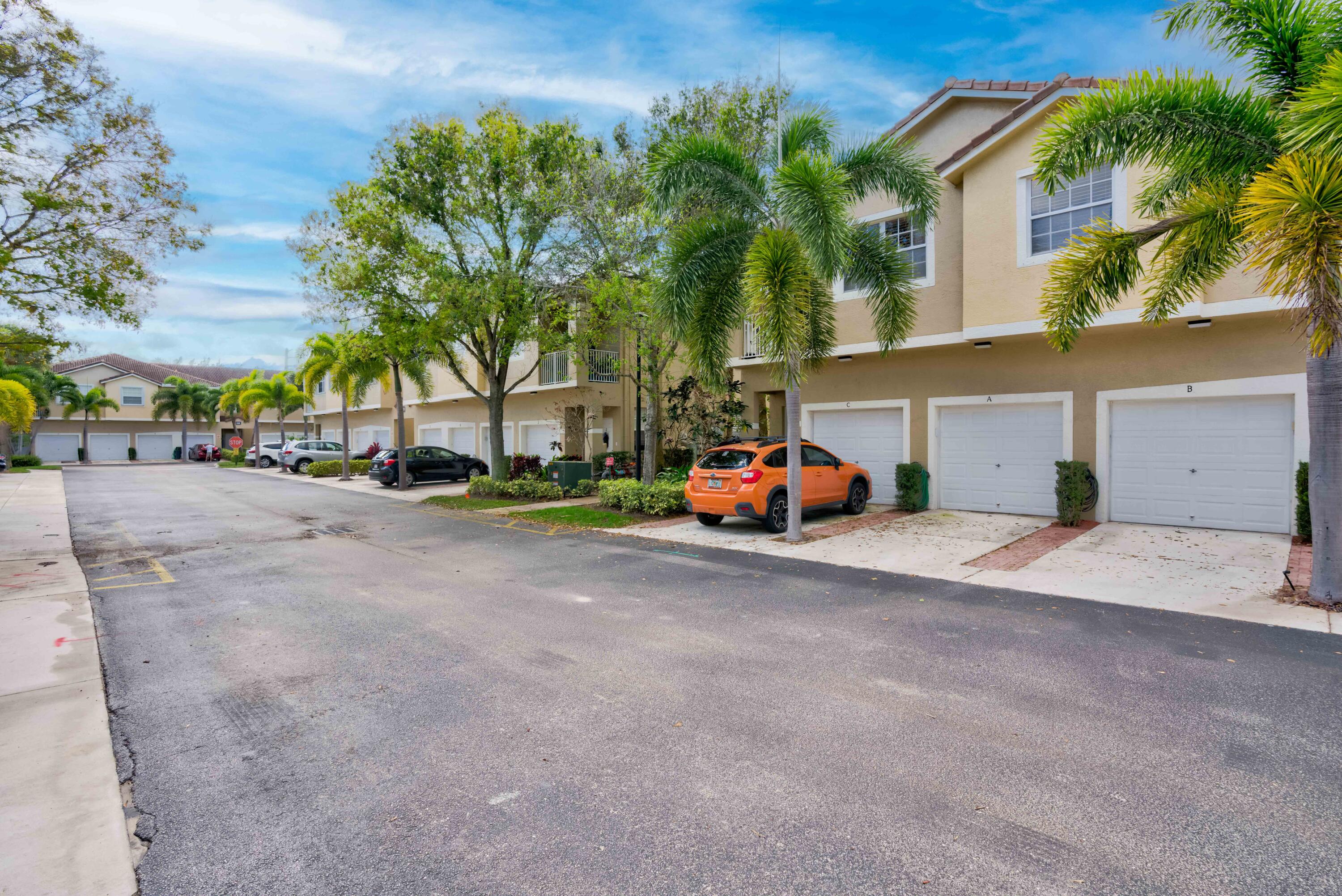 115 Lighthouse Circle, Unit B Tequesta, FL 33469 - Photo 7 of 42 a car parked in front of a house