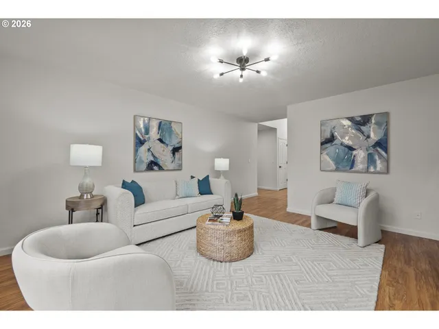 a living room with furniture and a lamp