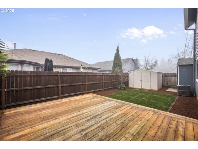 a view of outdoor space with wooden floor and umbrella