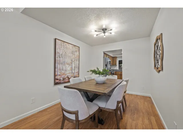 a view of a dining room with furniture and window