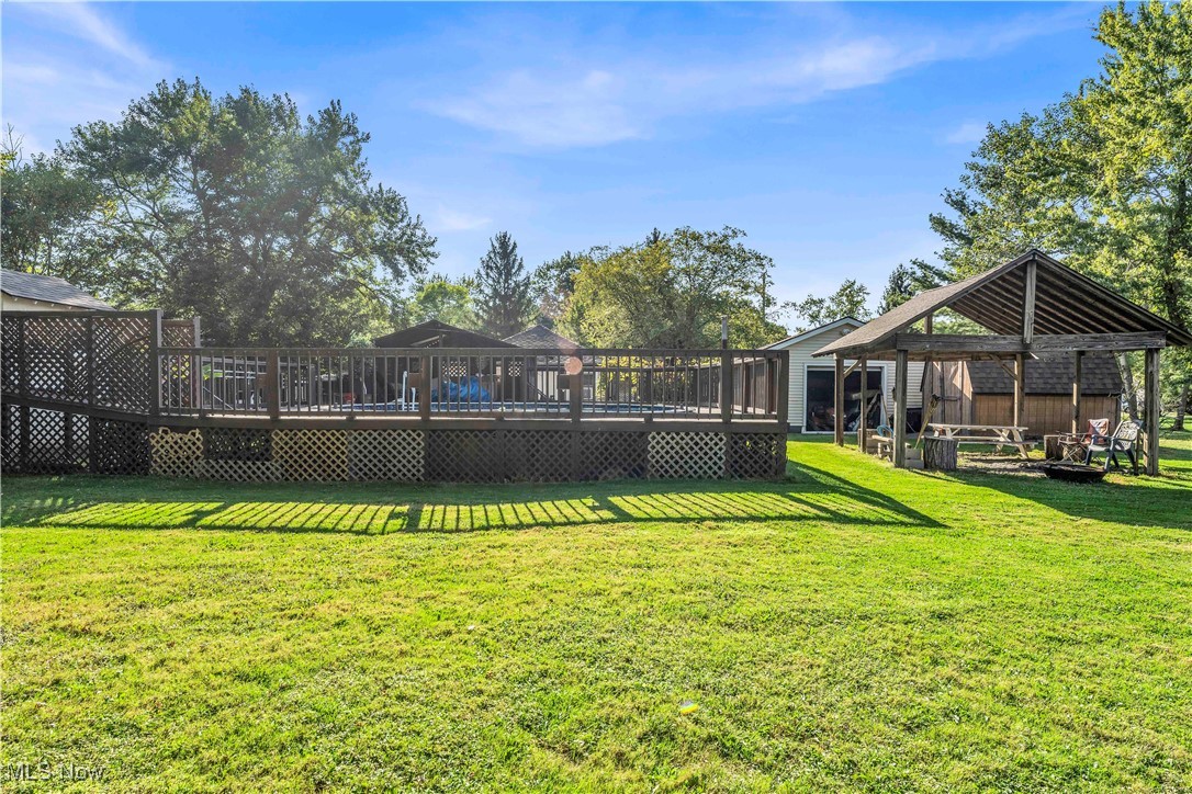7479 Macedonia Road Bedford, OH 44146 - Photo 13 of 42 View of yard featuring a wooden deck and a gazebo