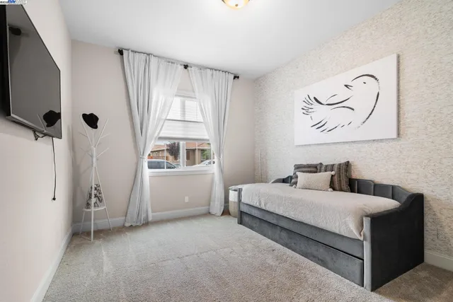 a room with a bed and a window