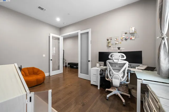 a living room with furniture a dining table and chairs