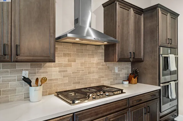 a kitchen with a stove and a sink