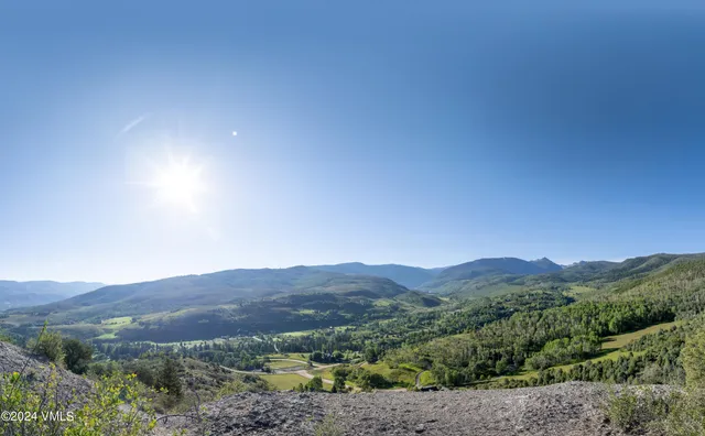 a view of residential houses with trees