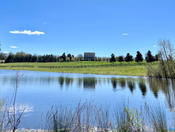 a view of a lake with a big yard