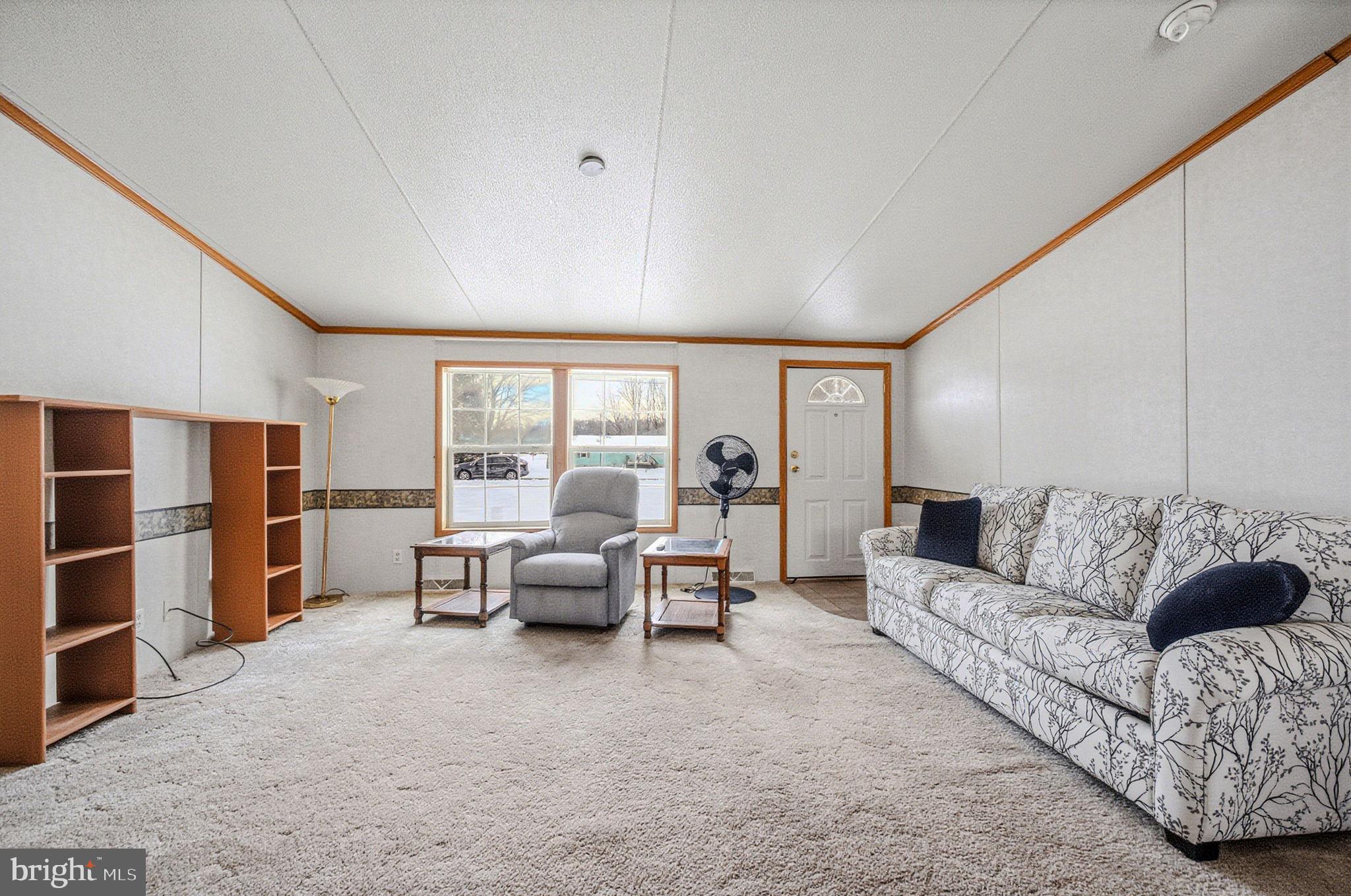 2237 Marshyhope Road Felton, DE 19943 - Photo 14 of 38 a living room with furniture and large window