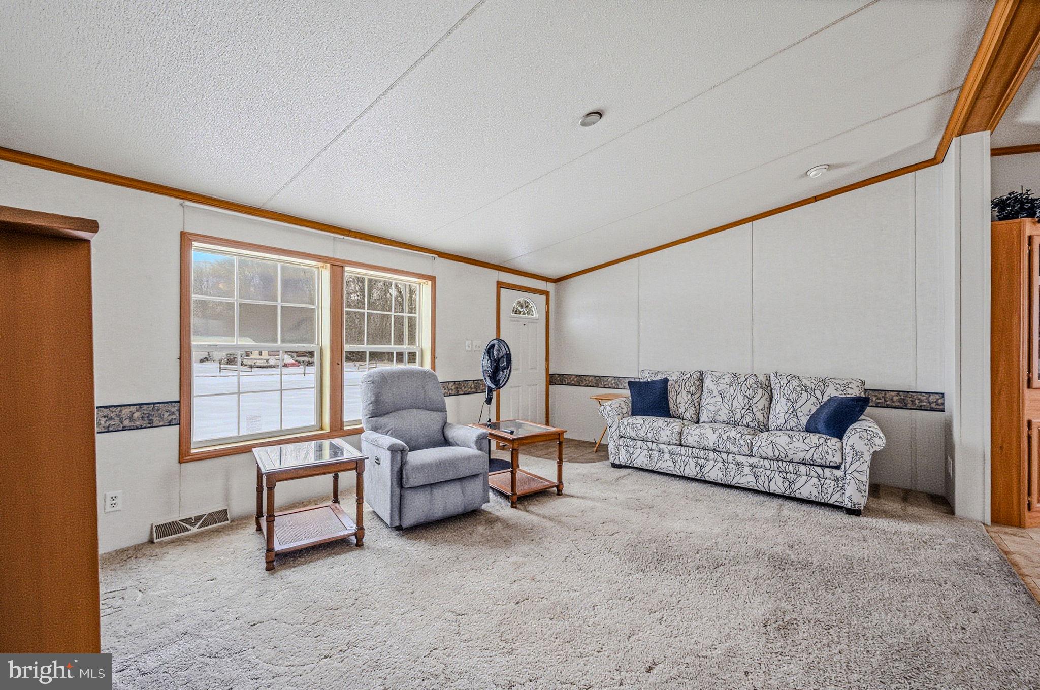 2237 Marshyhope Road Felton, DE 19943 - Photo 15 of 38 a living room with furniture and a large window