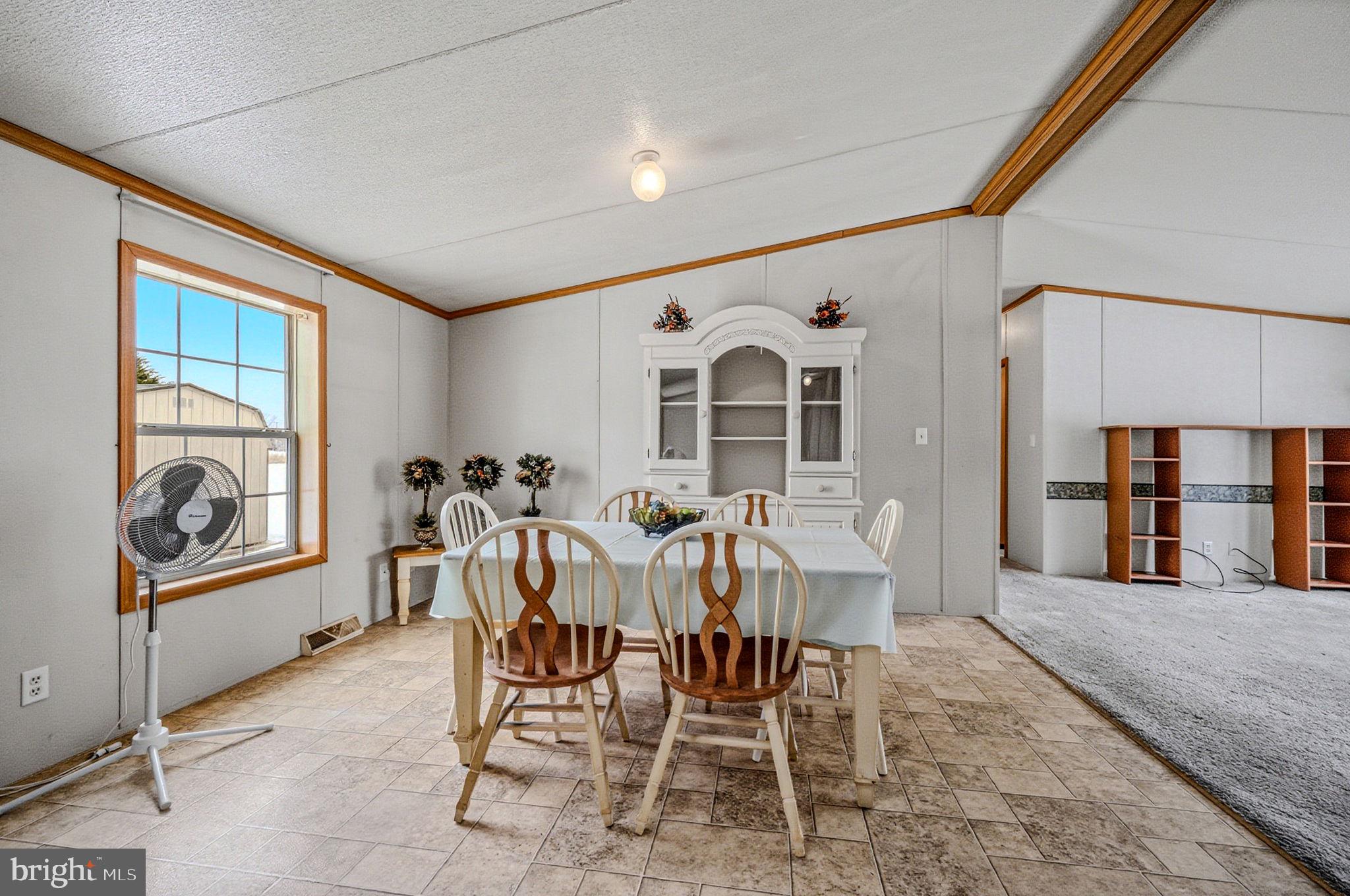 2237 Marshyhope Road Felton, DE 19943 - Photo 18 of 38 a view of a dining room with furniture window and outside view