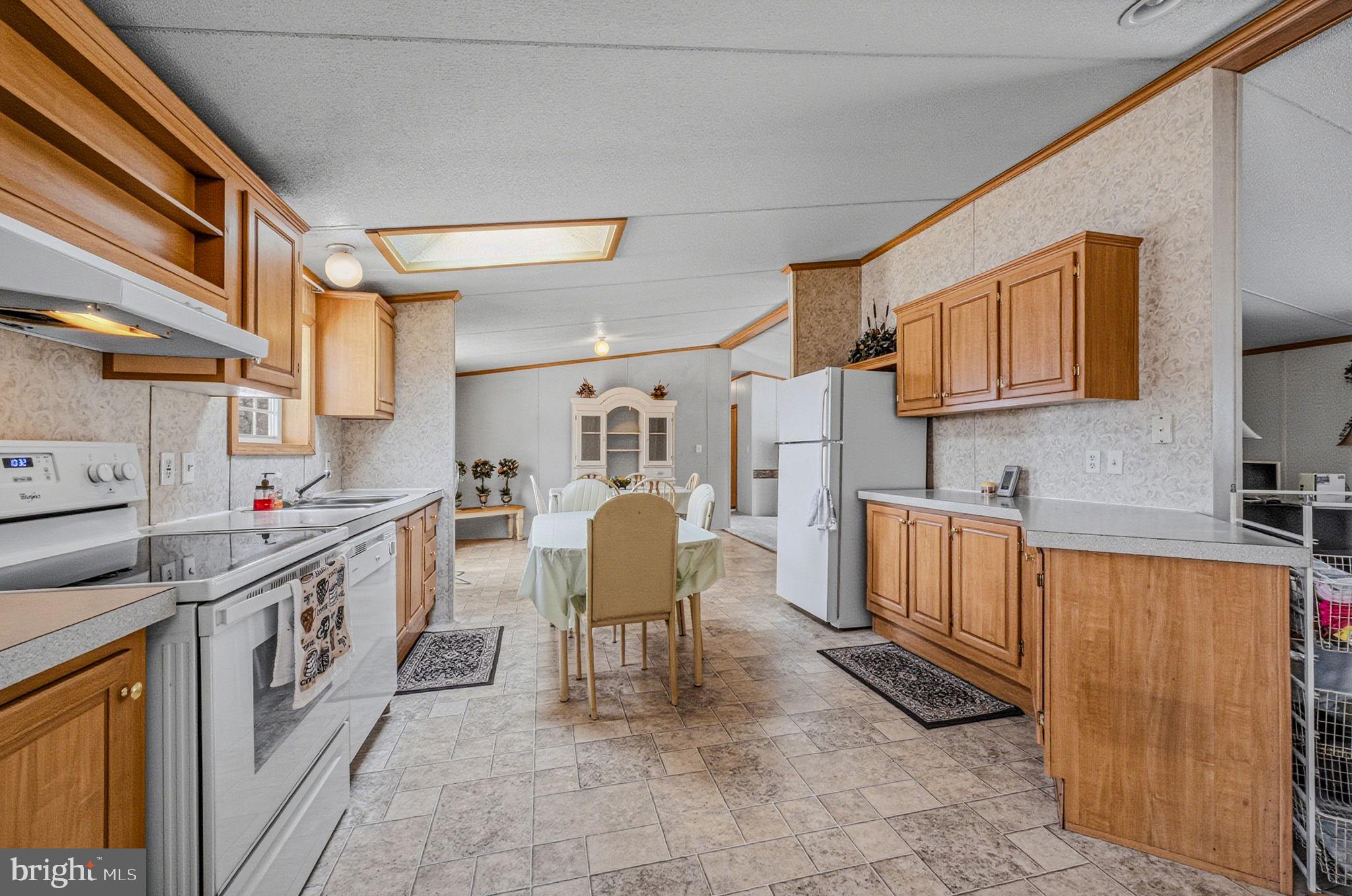 2237 Marshyhope Road Felton, DE 19943 - Photo 23 of 38 a view of a kitchen with furniture and electronic appliances