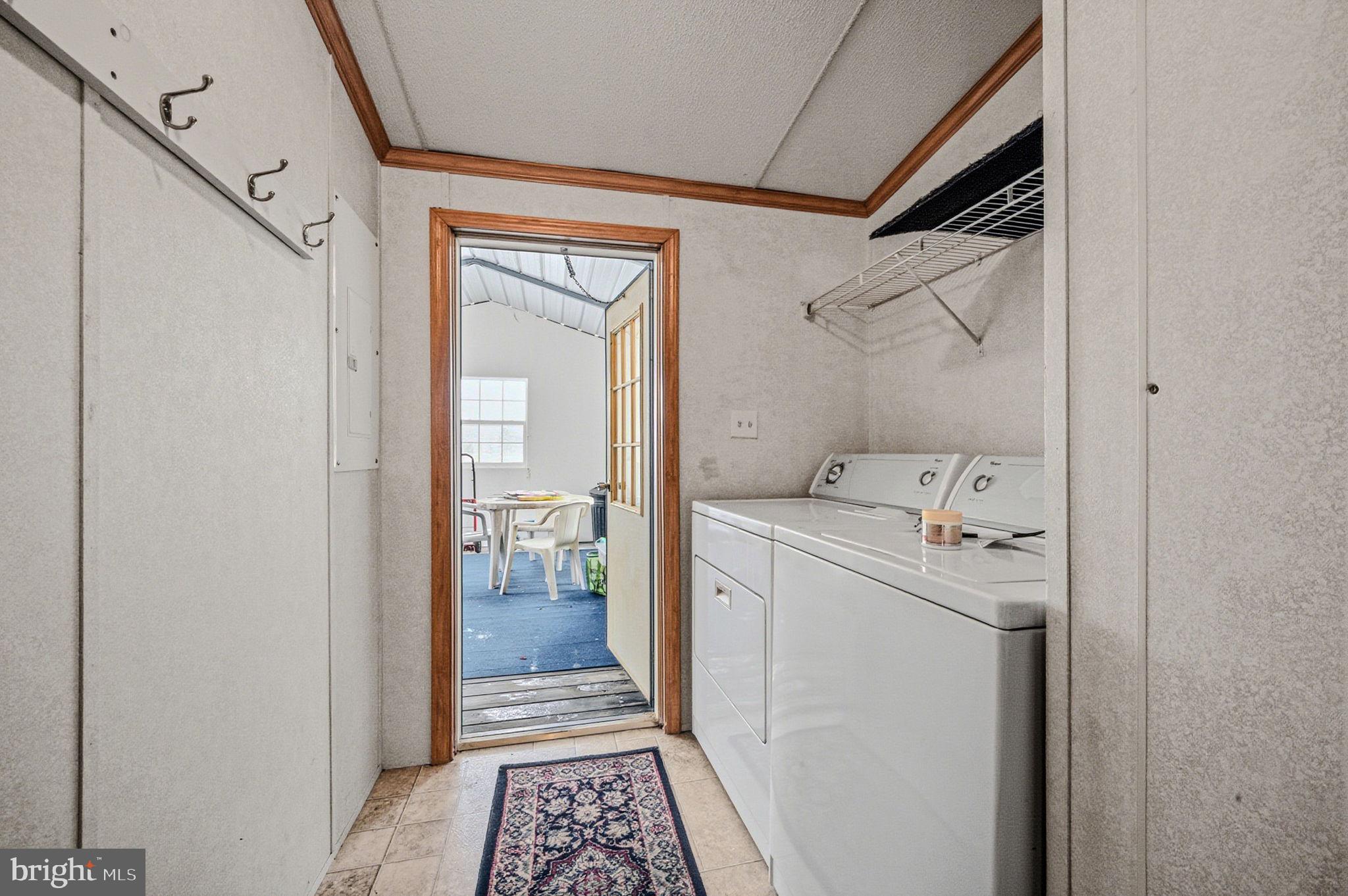 2237 Marshyhope Road Felton, DE 19943 - Photo 36 of 38 a storage room with a washer and dryer