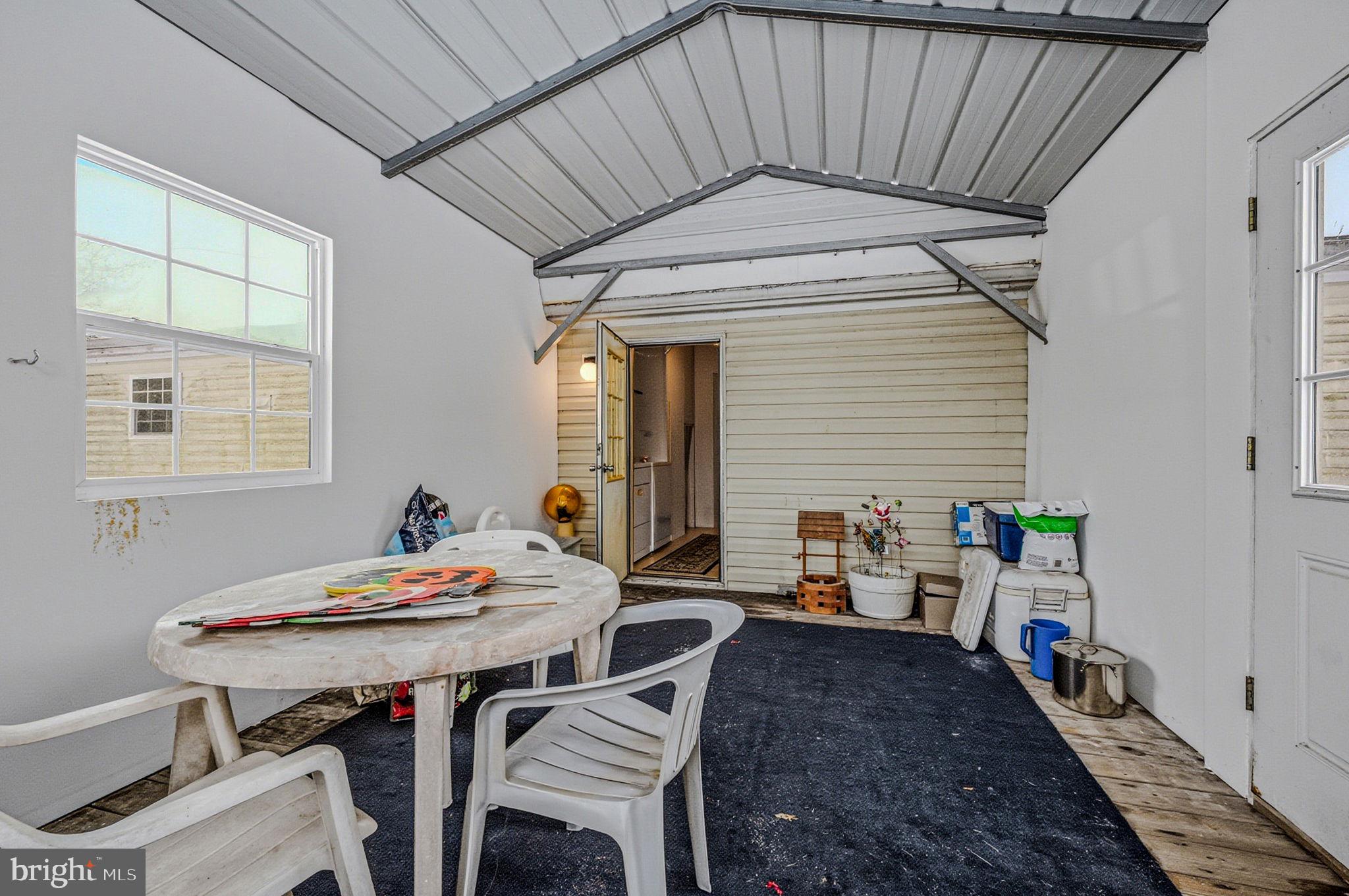 2237 Marshyhope Road Felton, DE 19943 - Photo 6 of 38 a dining room with furniture and window