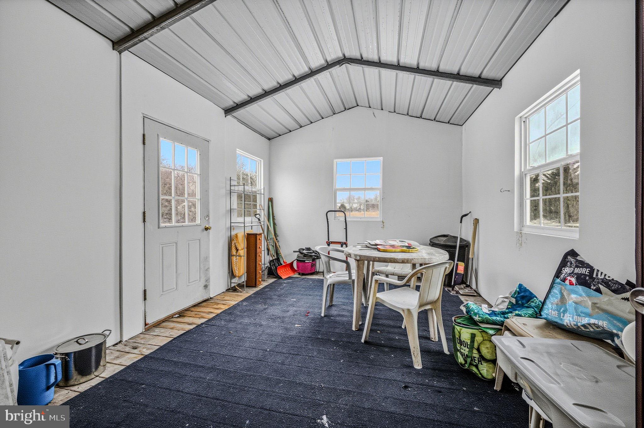 2237 Marshyhope Road Felton, DE 19943 - Photo 7 of 38 a very nice looking room with wooden floor and furniture