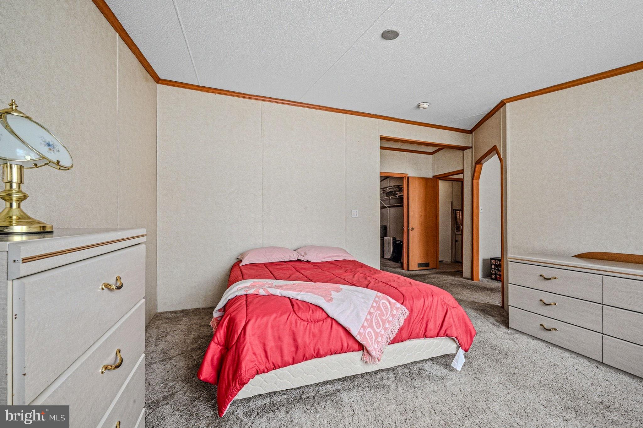 2237 Marshyhope Road Felton, DE 19943 - Photo 10 of 38 a bedroom with a bed and a dresser