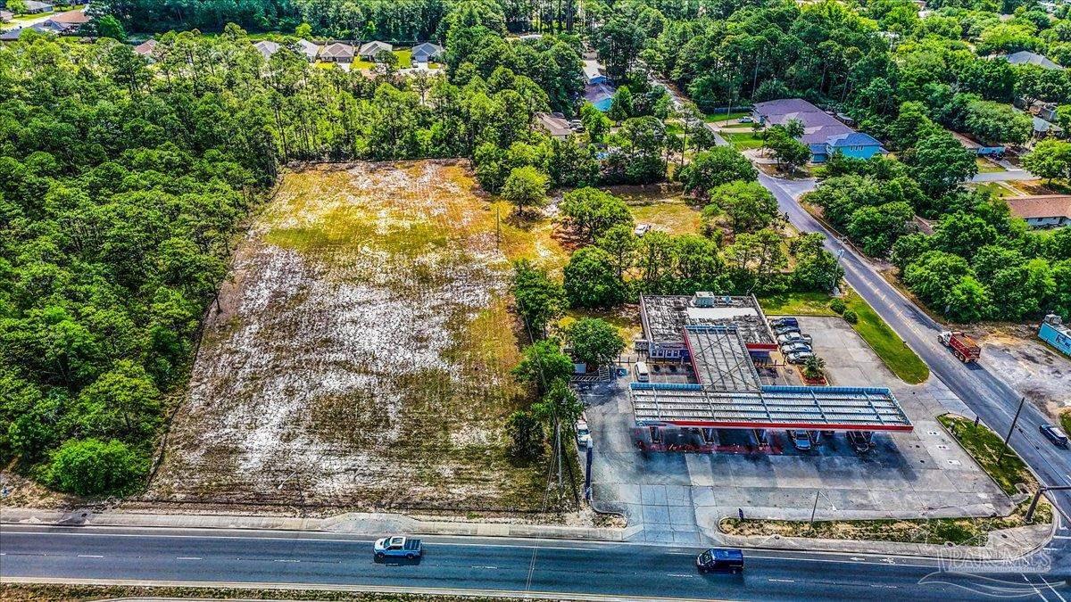 2032 Highway 87 Navarre, FL 32566 - Photo 8 of 11 swimming pool view with sitting space and garden view