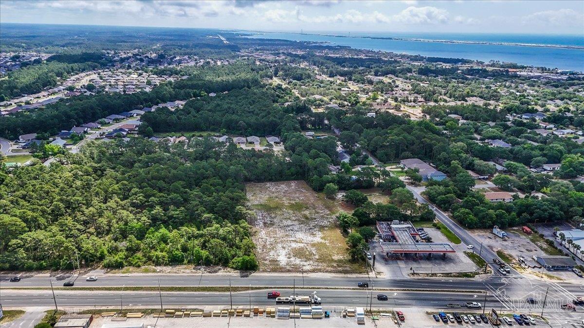 2032 Highway 87 Navarre, FL 32566 - Photo 10 of 11 an aerial view of a house with a yard