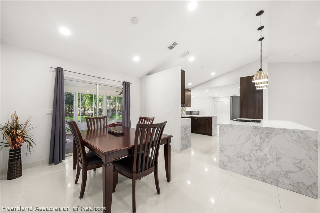 3102 Divot Road Sebring, FL 33872 - Photo 7 of 24 Dining room with access to porch