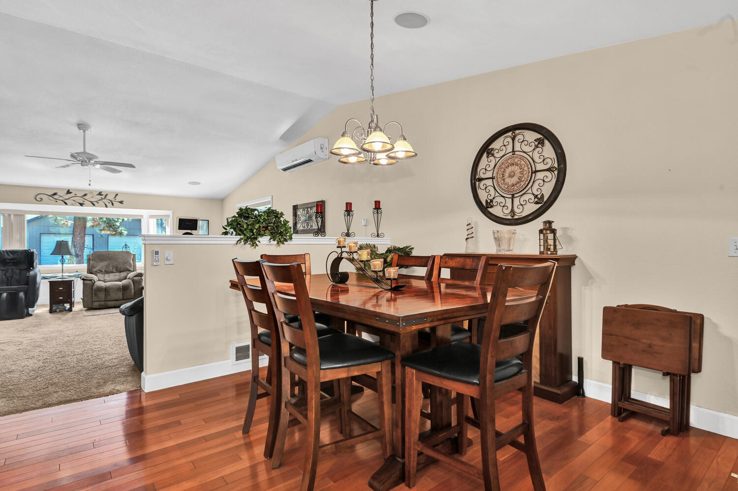 14840 Laurel Road La Pine, OR 97739 - Photo 11 of 32 a dining room with furniture a chandelier and wooden floor